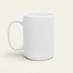 A plain white ceramic coffee mug with a C-shaped handle, shown from a three-quarter angle against a solid, light cream-colored background.