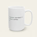 A white ceramic mug with a black printed code snippet that reads 'function startDay() { return coffee; }' on a clean white background.